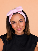 Pink bow headband worn on model island vibes